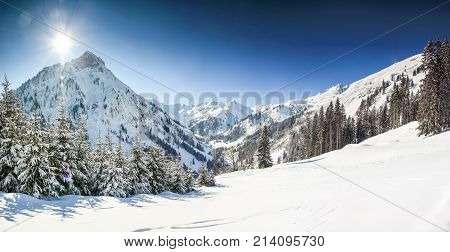Snow mountains winter landscape on sunny day. Allgaeu Alps, Bavaria in Germany.