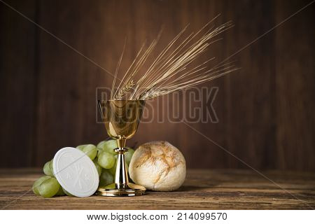 Eucharist symbol of bread and wine, chalice and host, First communion background