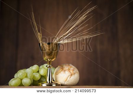 Eucharist symbol of bread and wine, chalice and host, First communion background