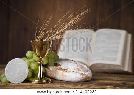 Eucharist symbol of bread and wine, chalice and host, First communion background