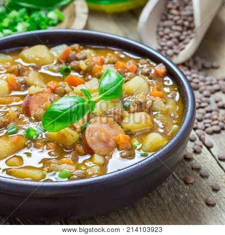 Homemade soup with lentils and sausages square format