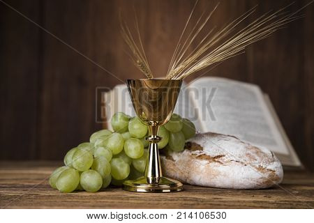 Eucharist symbol of bread and wine, chalice and host, First communion background