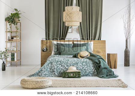 Wicker Lampshade Above Bed
