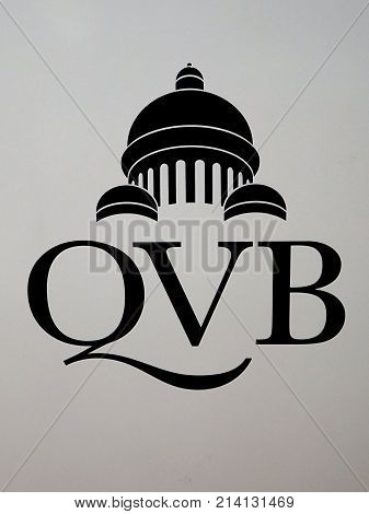 Sydney Australia - November 03 2017: Queen Victoria Building logotype on gray. Rich in history QVB occupies an entire block on Sydney's George Street and has over 180 shops.