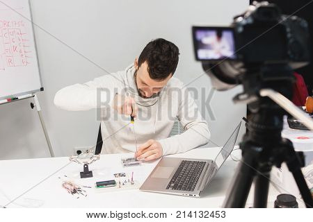 video tutorial creation filming backstage concept. passionate about work. Assembly of mechatronics.