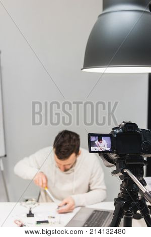 video tutorial creation filming backstage concept. passionate about work. Assembly of mechatronics.