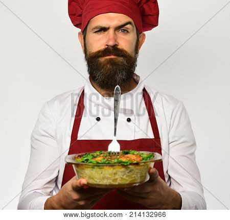 Man With Beard On White Background. Cooking And Vegetarian Diet