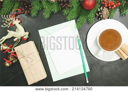 Christmas background or Xmas card with decorations fir gift box and ornamen. Space for Holiday Greetings. Top view. Planning of New Year's holidays