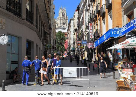 MADRID, SPAIN - MAY 24, 2017: Tetuan Street is one of the typical old small streets in the city center next to Puerta del Sol.