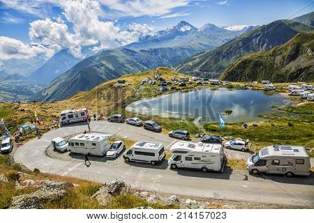 Col de la Croix de Fer France - 25 July 2015: Caravans and fans waiting for the peloton on the road to the Col de la Croix de Fer in Alps during the stage 20 of Le Tour de France 2015.