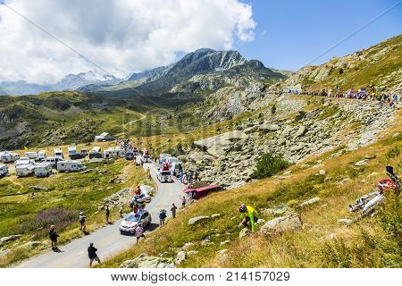 Col de la Croix de Fer France - 25 July 2015: Le Gaulois caravan driving on the road to the Col de la Croix de Fer in Alps during the stage 20 of Le Tour de France 2015. Le Gaulois is an important French producer of poultry meat products.