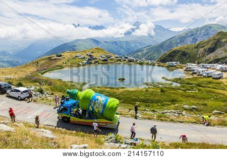 Col de la Croix de Fer France - 25 July 2015: Teisseire caravan driving on the road to the Col de la Croix de Fer in Alps during the stage 20 of Le Tour de France 2015. Teisseire produces fruit juices and syrups for the food service industry.