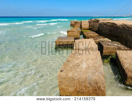 Concrete Blocks Wave Breaker On Ionian Sea Coast , Salento, Italy