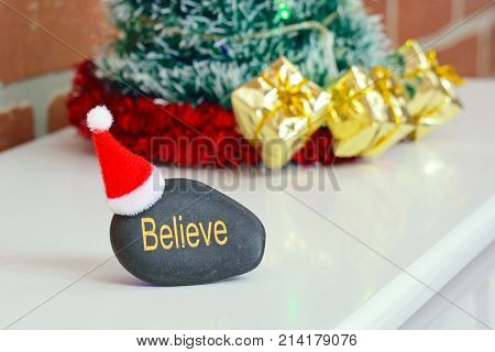 Concept image about believing in Santa Claus. Includes copy space on the white mantelpiece.
