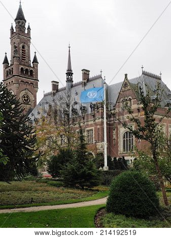 The Hague Netherlands - November 3 2017: The Peace palace tower gardens and the flag home of the international court of justice.