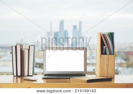 Creative Desk Top With Empty White Laptop