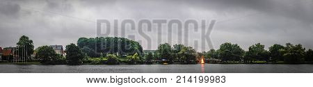 HADERSLEV DENMARK - JUNE 23 - 2017: People celebrating St. Johns day in the midsummer with a large bonfire on a river