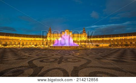 Night at Plaza de Espana, with violet moving fountain at sunset from dusk to night