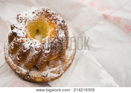 Traditional Alsace regional Kugelhopf bundt cake on white background with copy space