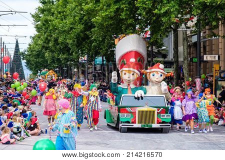 Adelaide Australia - November 18 2017: Parade participants walk along crowd of people during Adelaide's 85th Credit Union Christmas Pageant parade