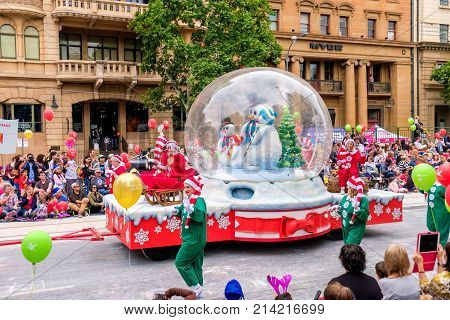 Adelaide Australia - November 18 2017: Parade participants walk along crowd of people during Adelaide's 85th Credit Union Christmas Pageant parade