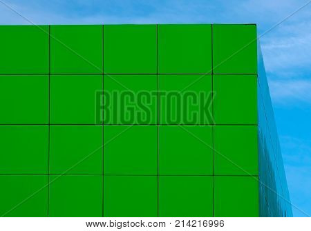 abstract green background with square tiles of the facade