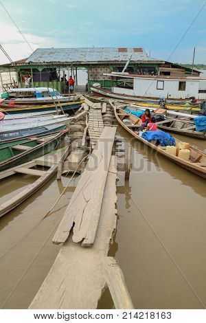 Wooden Canoe In River Port