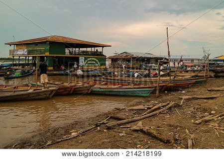 Wooden Canoe In River Port