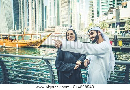 Arabic couple with traditional clothes dating outdoors