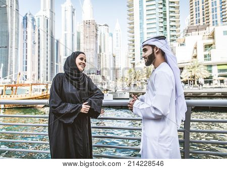Arabic couple with traditional clothes dating outdoors