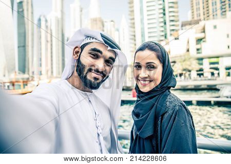 Arabic couple with traditional clothes dating outdoors