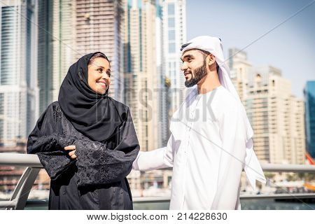 Arabic couple with traditional clothes dating outdoors