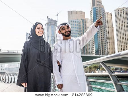 Arabic couple with traditional clothes dating outdoors