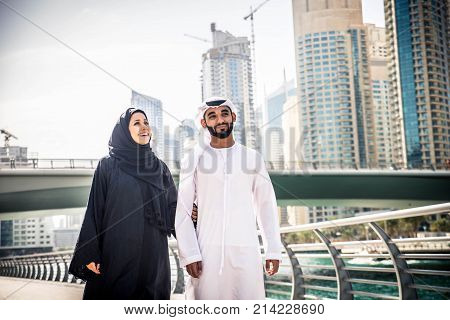 Arabic couple with traditional clothes dating outdoors