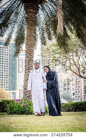 Arabic couple with traditional clothes dating outdoors