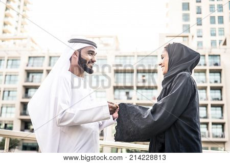 Arabic couple with traditional clothes dating outdoors