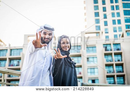 Arabic couple with traditional clothes dating outdoors