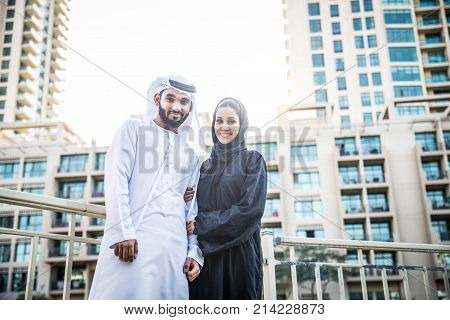 Arabic couple with traditional clothes dating outdoors