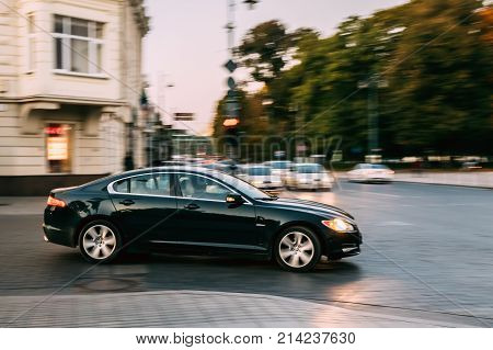 Vilnius, Lithuania - September 29, 2017: Side View Of Black Color Jaguar Car Moving On Street.