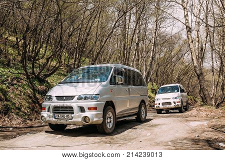 Stepantsminda Gergeti, Georgia - May 23, 2016: Mitsubishi Delica Space Gear on country road in spring mountains landscape. Delica is a range of trucks and multi-purpose vehicles produced by Mitsubishi Motors.