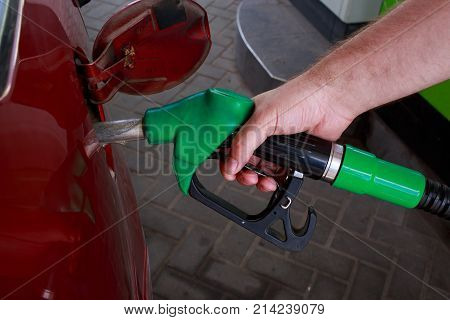 car fill with gasoline at a gas station