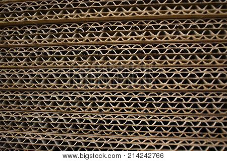 Stack of cardboard in a pile, seen from the side