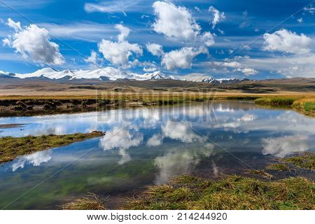 Amazing mountain landscape with river and clouds. Plateau Ukok, Altai