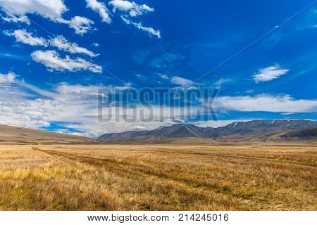 Mountain landscape with beautiful sky and clouds. Plateau Ukok, Altai