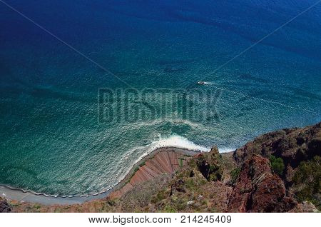 Impressive view of the Atlantic ocean and coastline as it is seen from one of the famous tourist viewpoint - the highest european cliff called Cabo Girao located in Madeira Portugal.
