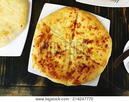 Traditional Georgian pie - khachapuri is a cake baked in the oven with cheese