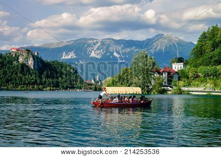 Colorful summer scene on the Bled lake with medieval castle Blejski grad. Slovenia, Europe.