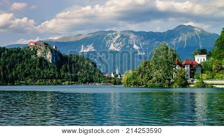 Colorful summer scene on the Bled lake with medieval castle Blejski grad. Slovenia, Europe.