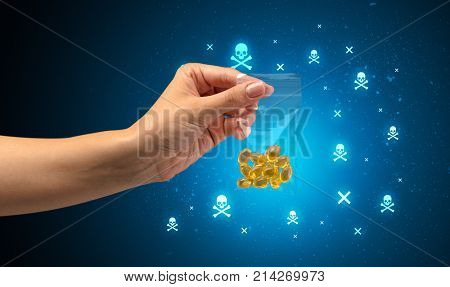 Female handing over pills with skull concept 