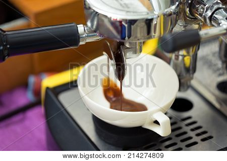 pouring from coffee machine - strock image